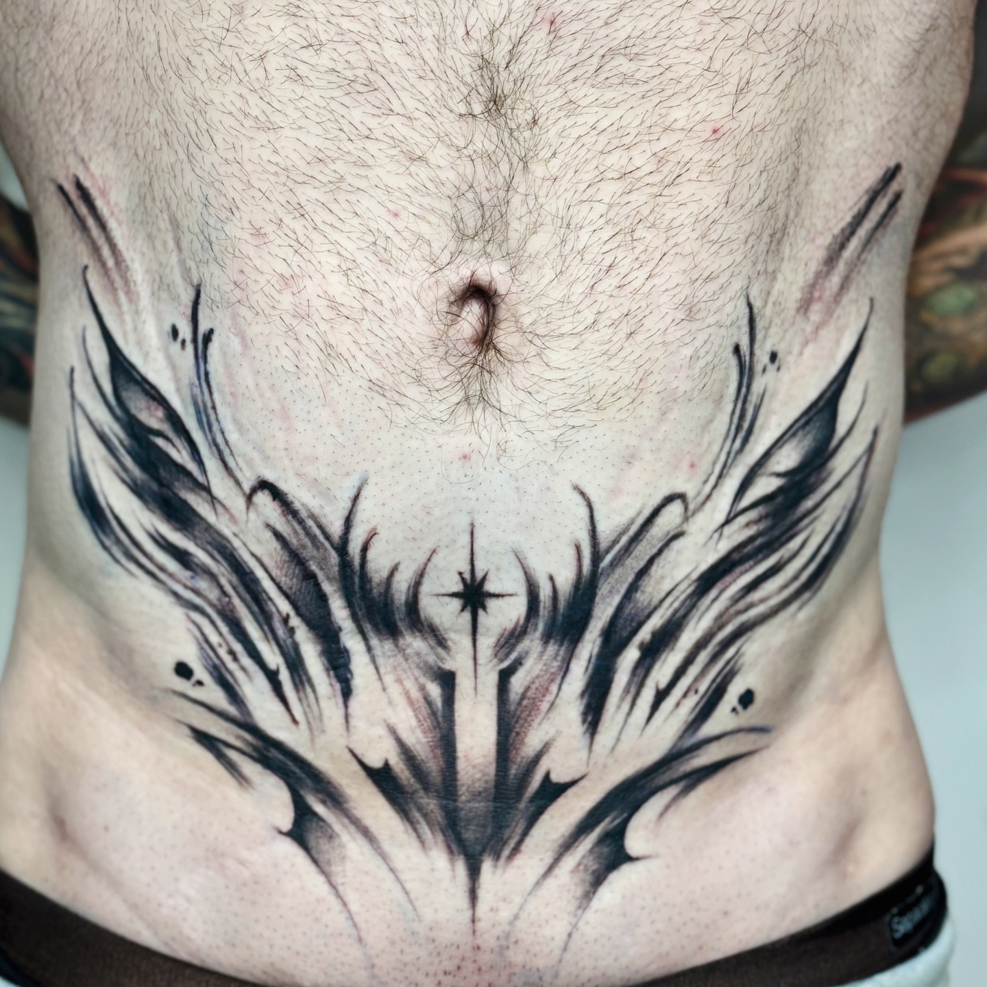 Abstract Blackwork Stomach Tattoo