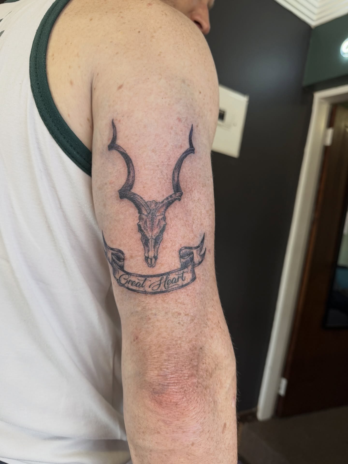 Horned Bull Tricep Tattoo