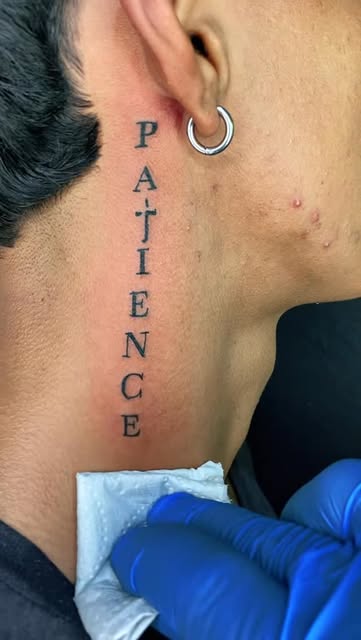 Lettering Neck Tattoo