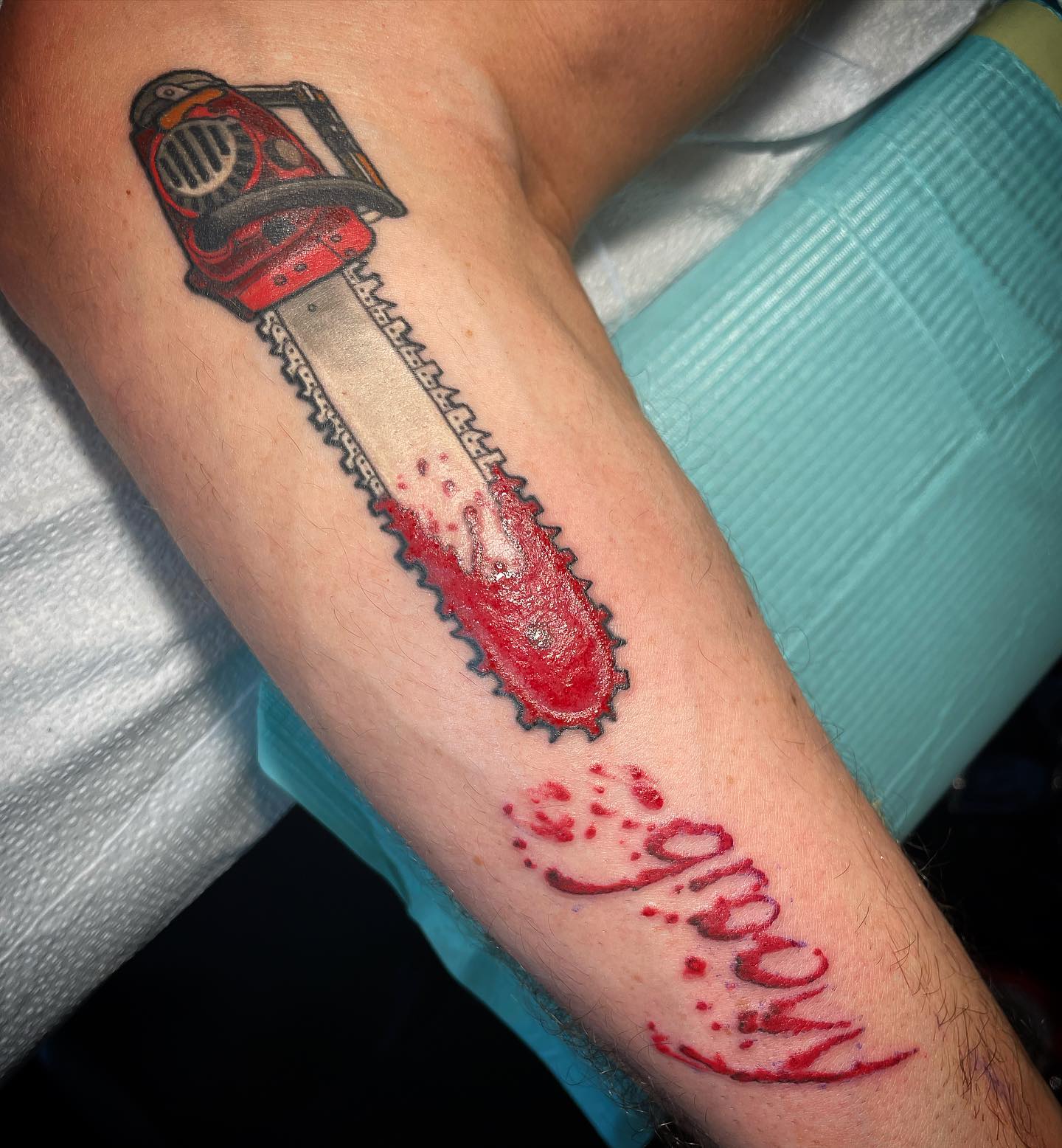Blood-Spattered Chainsaw Tattoo