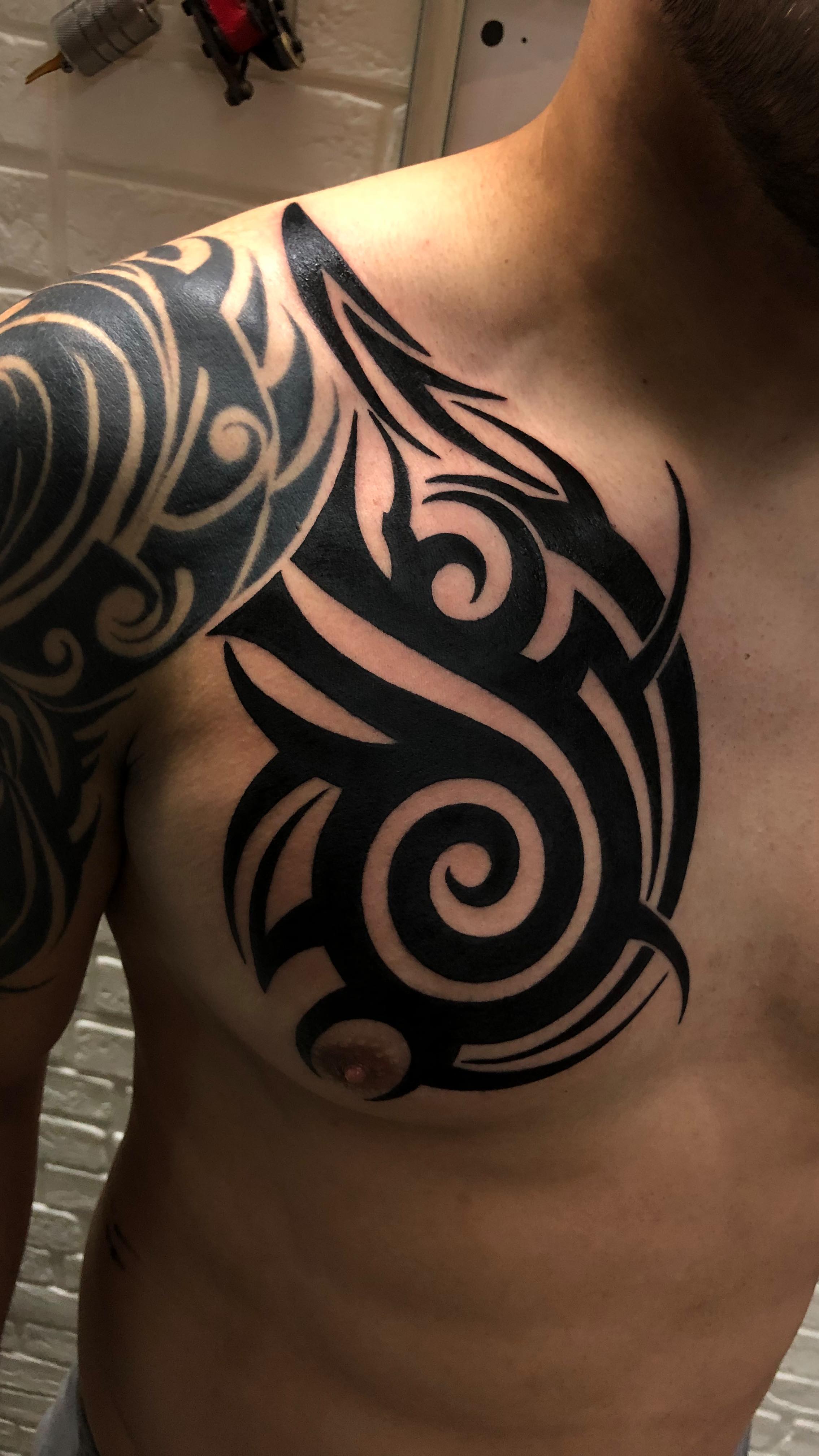 Bold Tribal Chest Tattoo