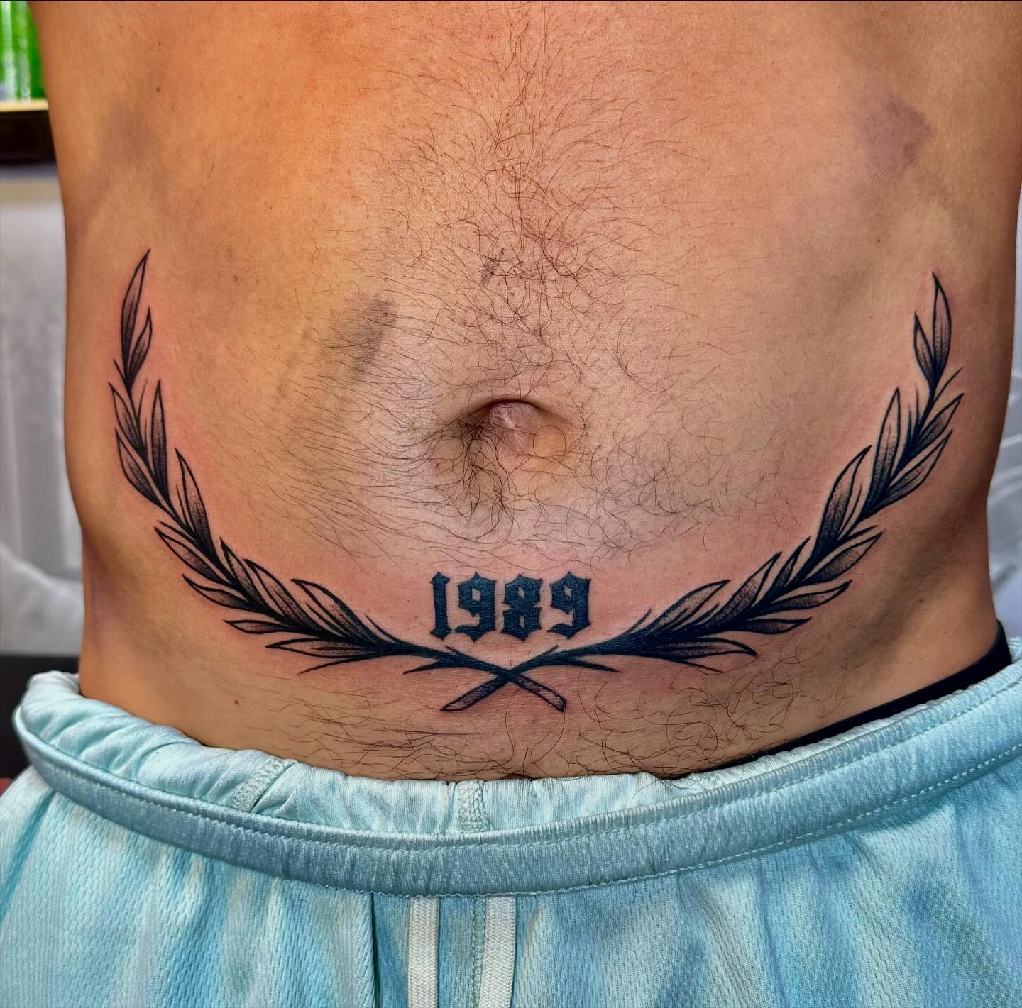Bottom Stomach Laurel Tattoo