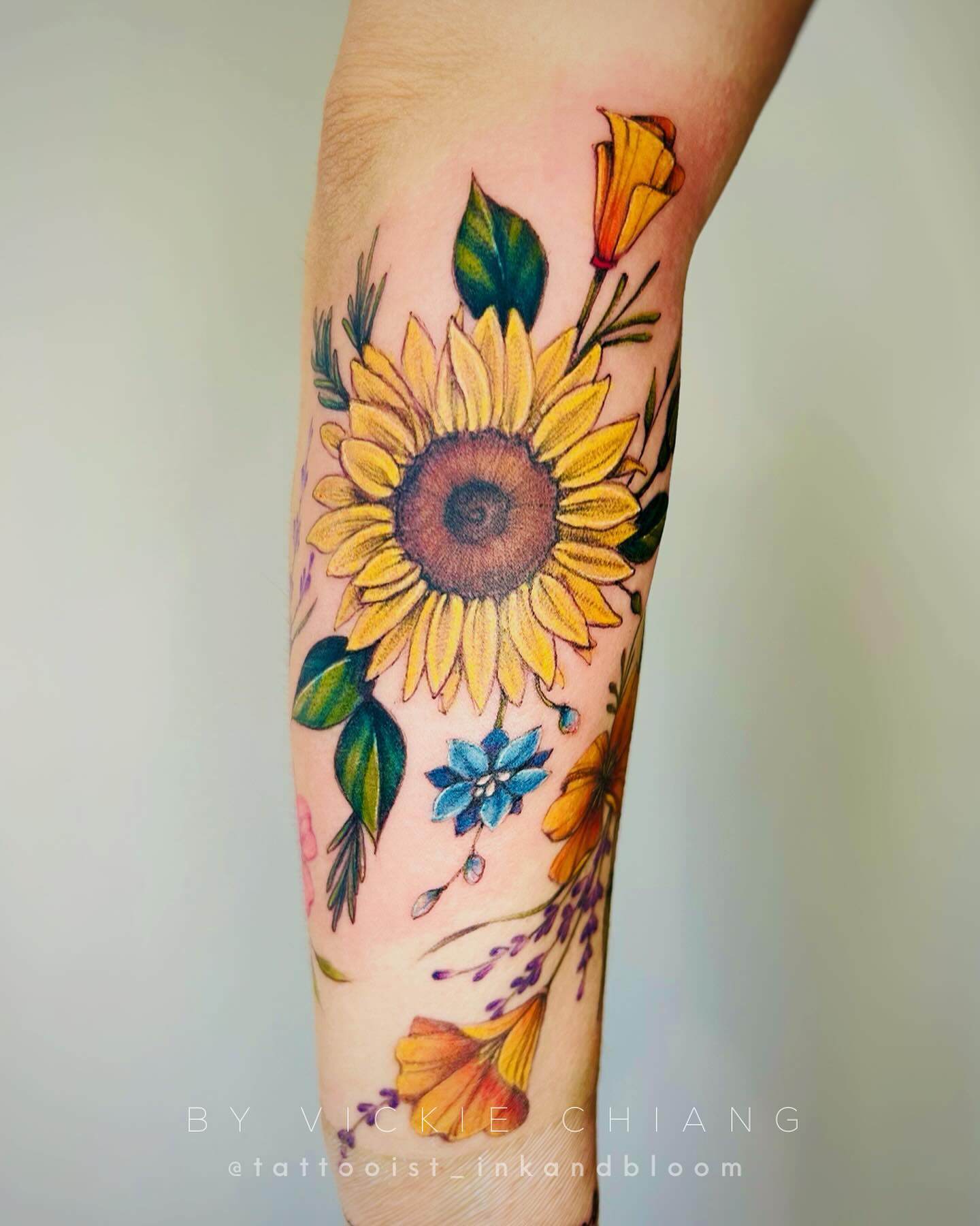 Bright Floral Arm Tattoo