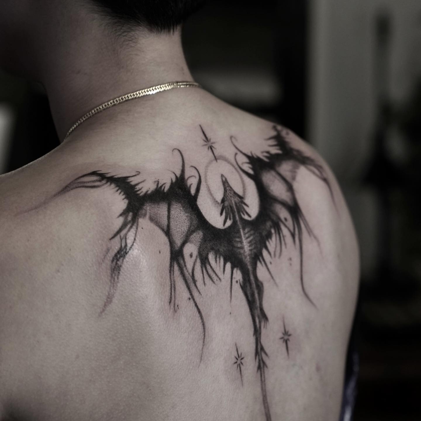 Dark Abstract Winged Tattoo