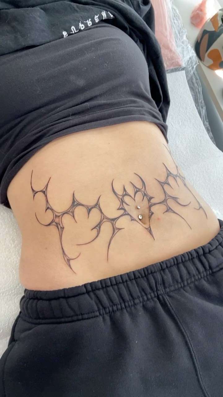 Delicate Abstract Stomach Tattoo
