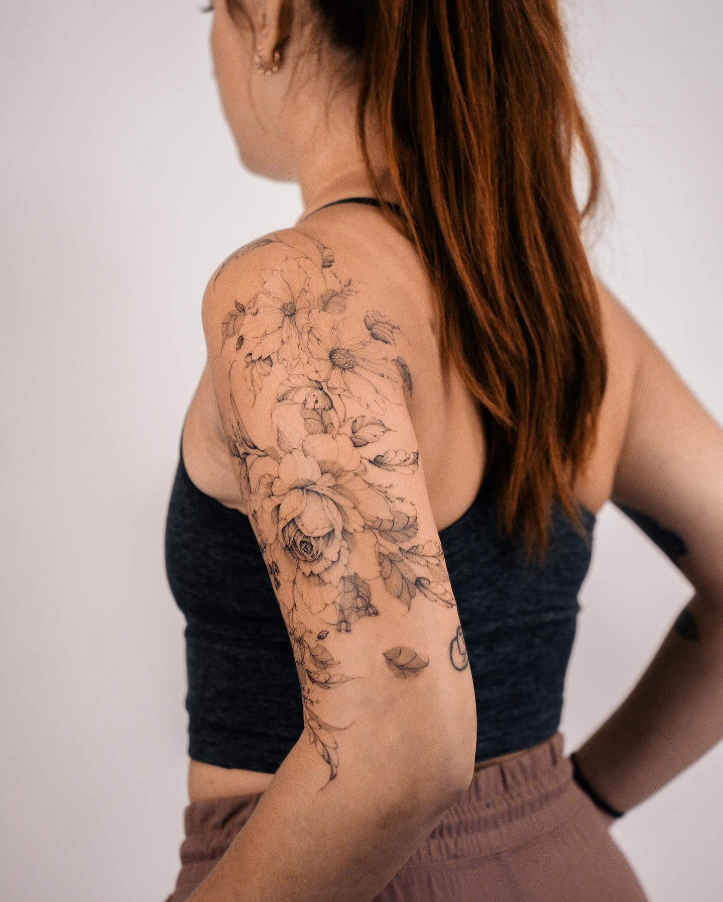 Delicate Black Floral Arm Tattoo