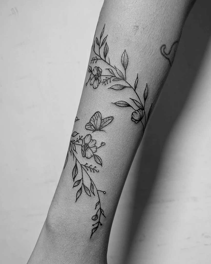 Delicate Floral Arm Tattoo