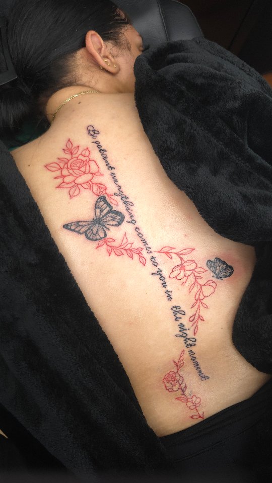 Delicate Floral Back Tattoo