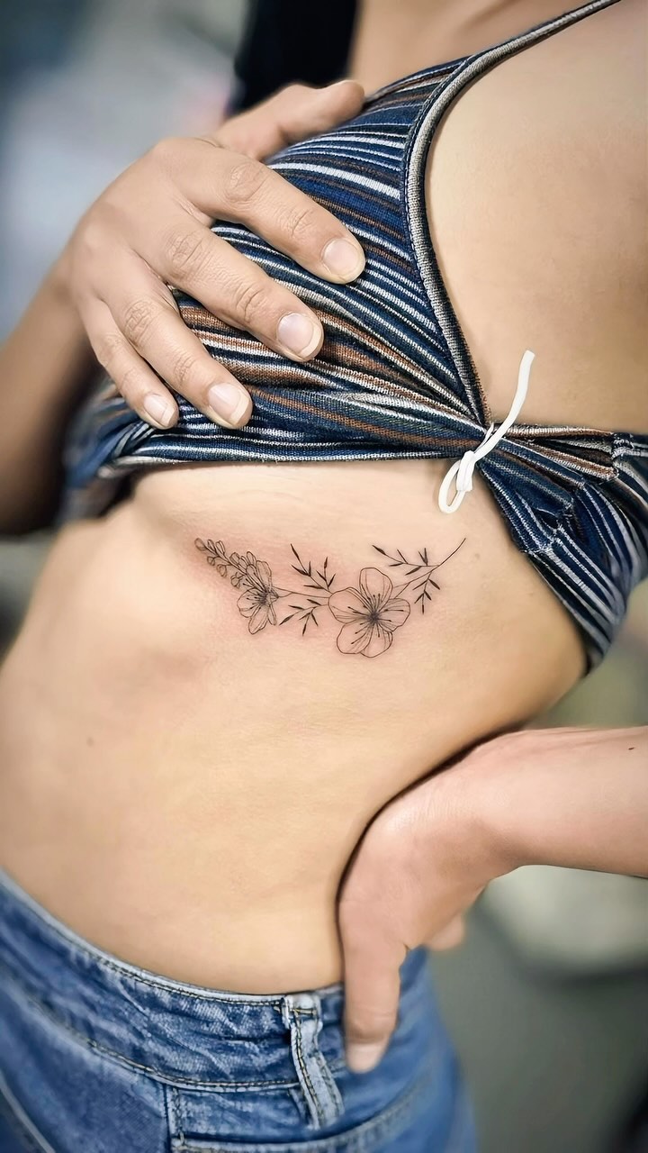 Delicate Floral Rib Tattoo