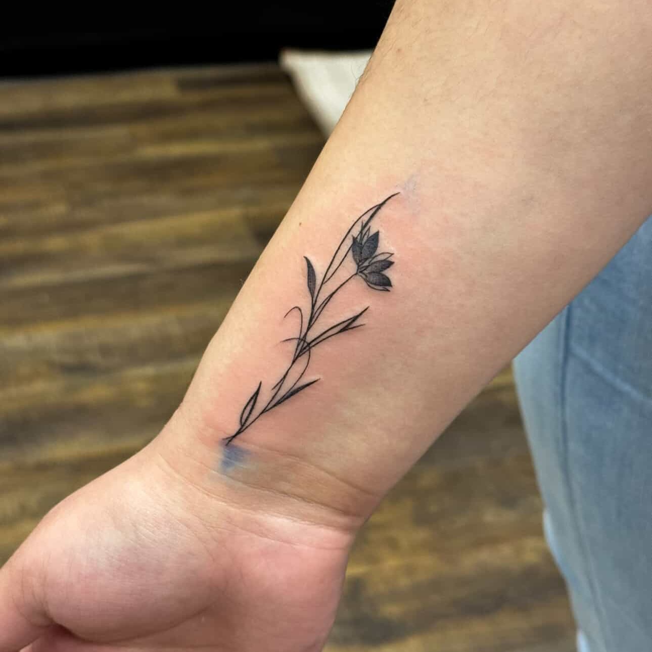 Delicate Floral Wrist Tattoo