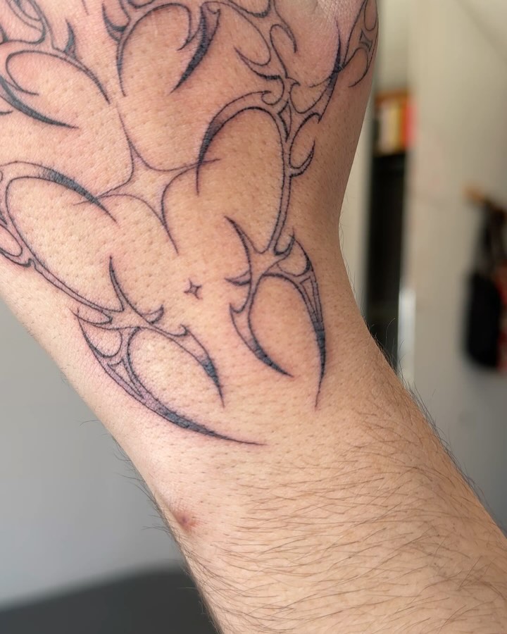 Delicate Hand Outline Tattoo