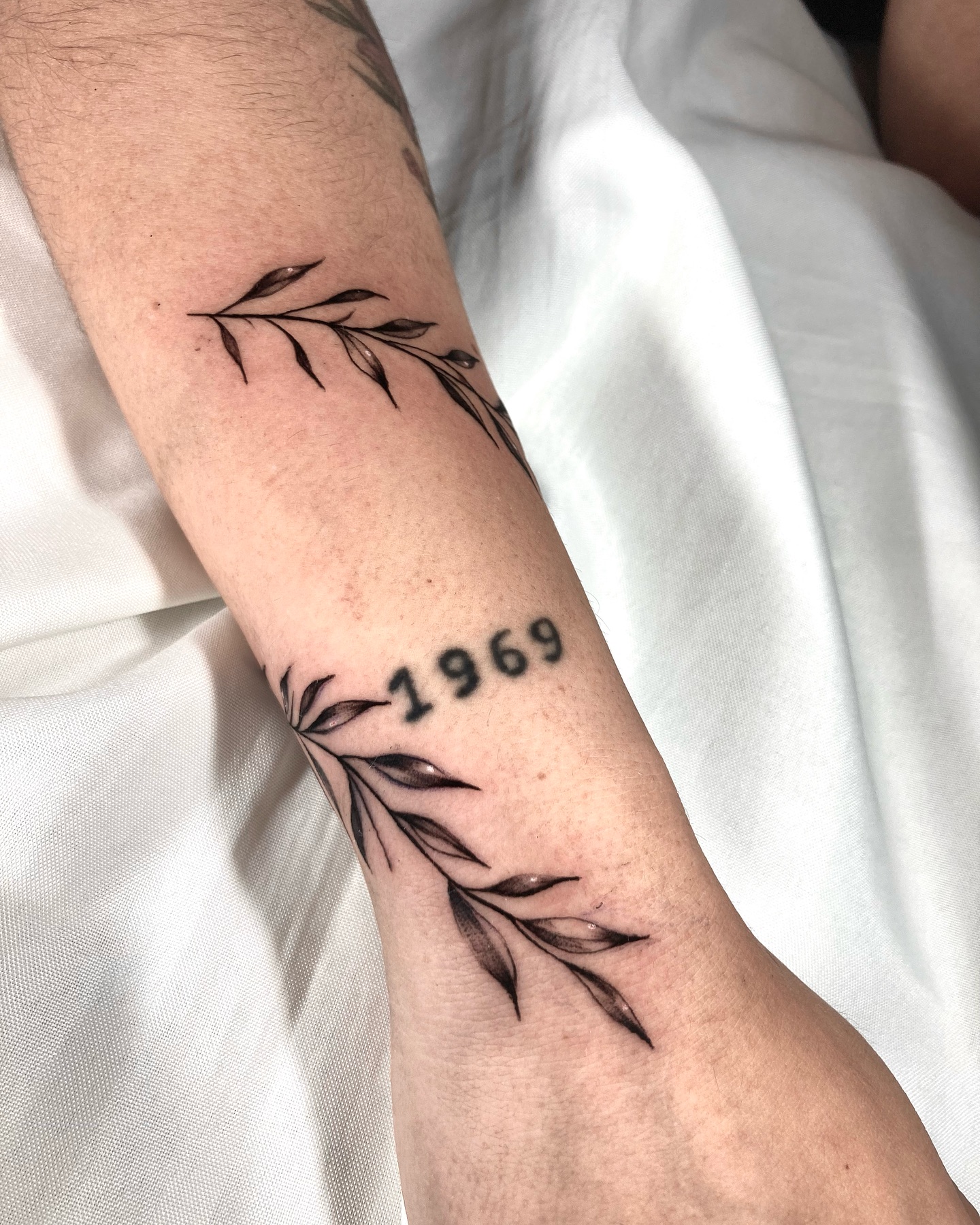 Delicate Leaf and Number Tattoo