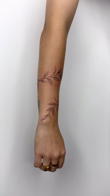 Delicate Leafy Arm Tattoo