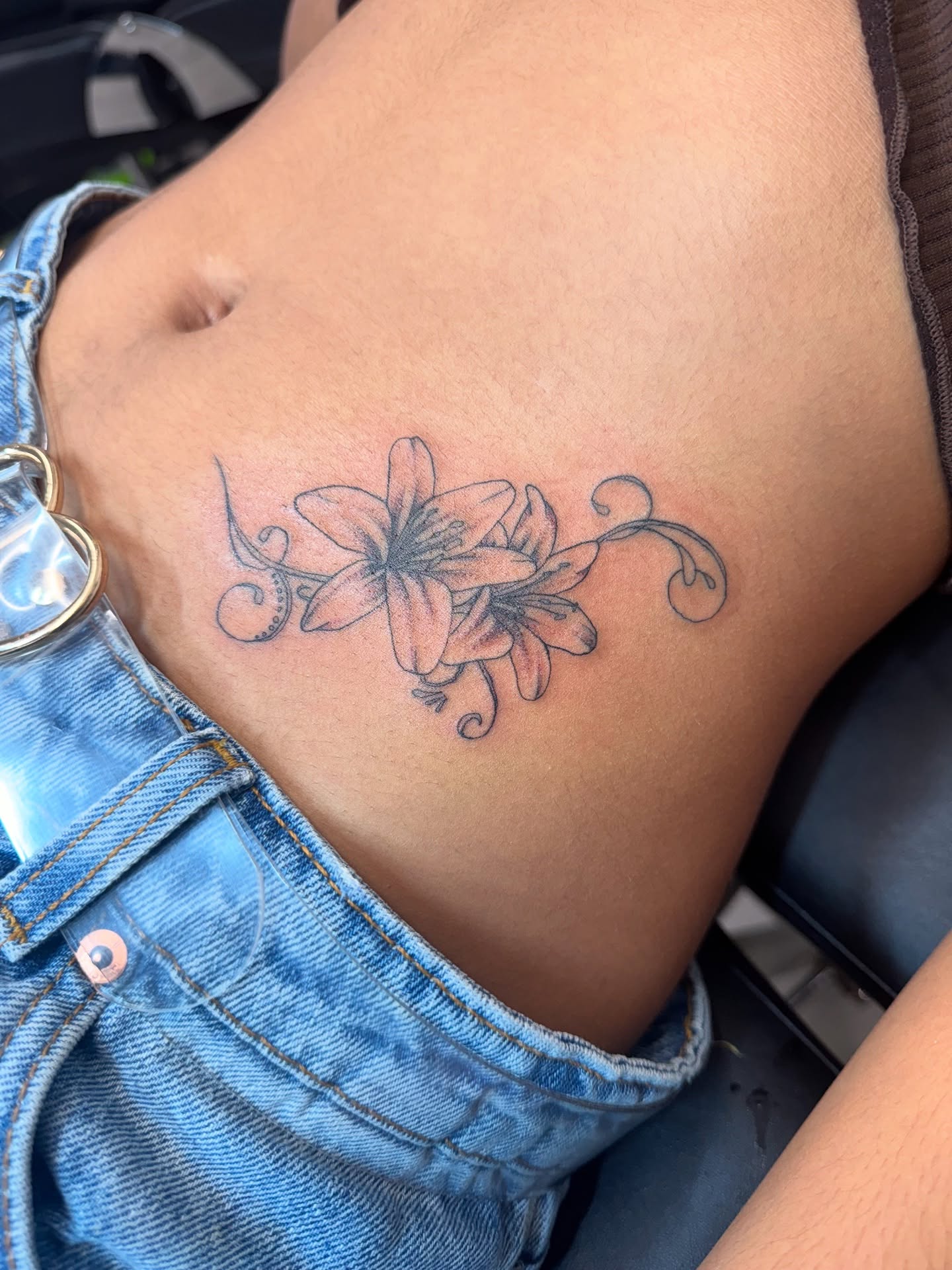 Delicate Lily Stomach Tattoo