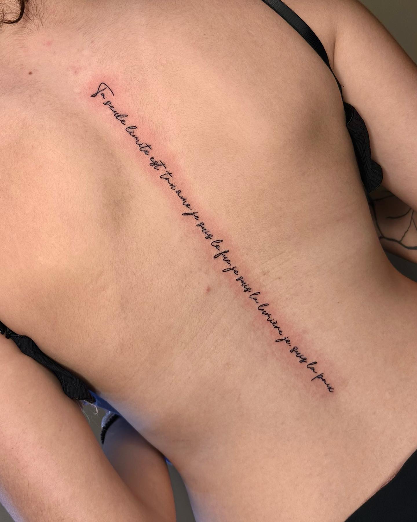 Delicate Script Back Tattoo