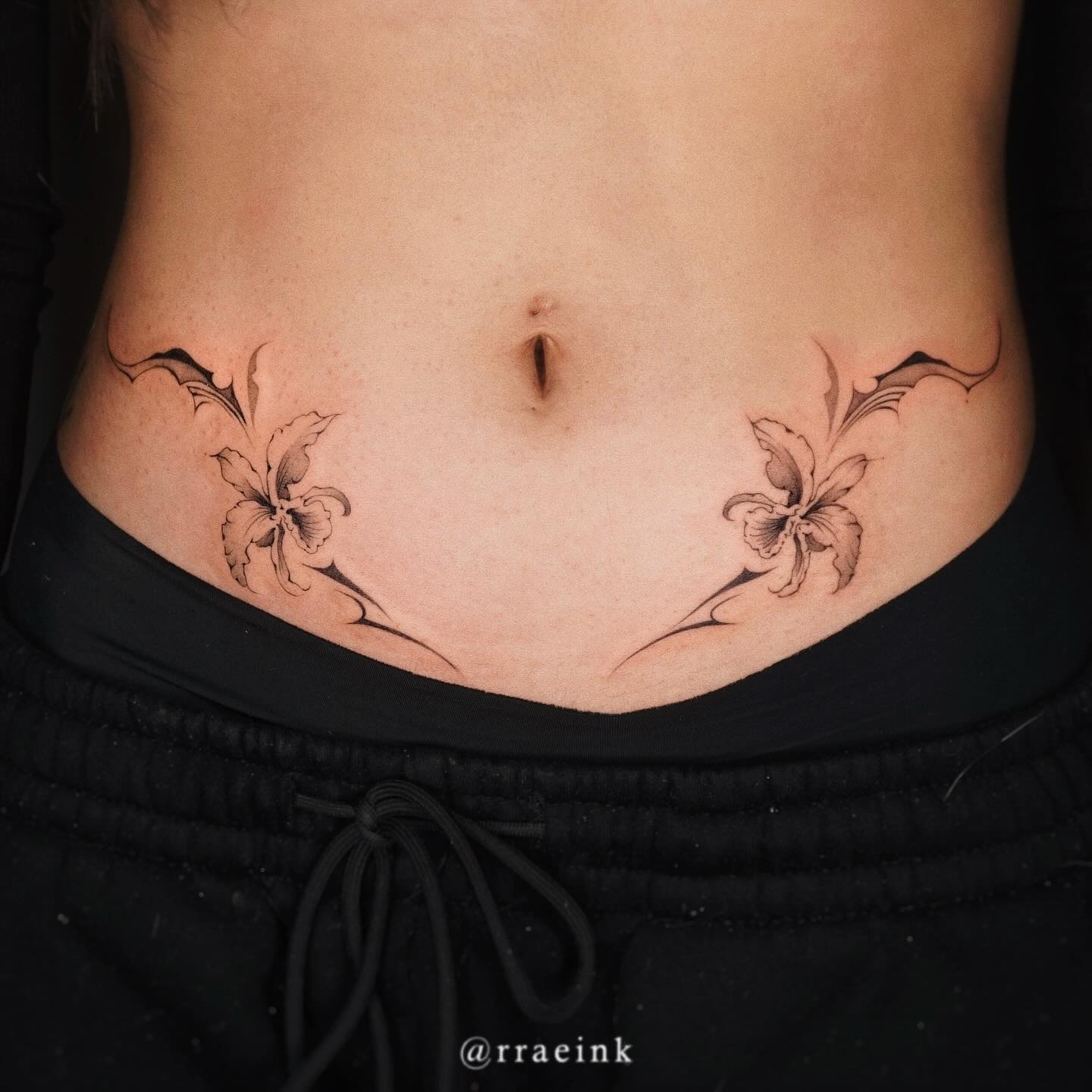Elegant Floral Stomach Tattoo