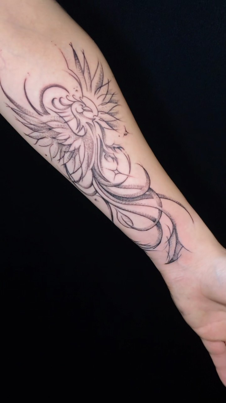 Elegant Phoenix Arm Tattoo