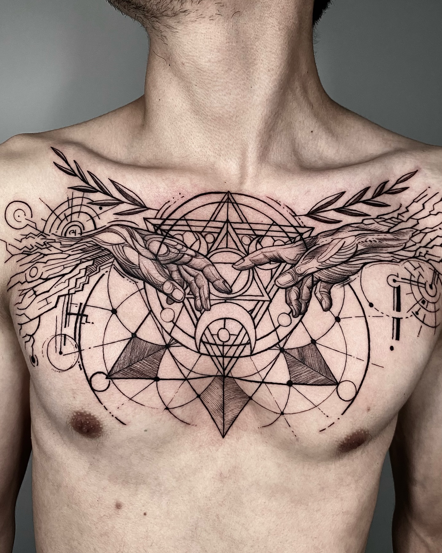 Geometric Hands Chest Tattoo