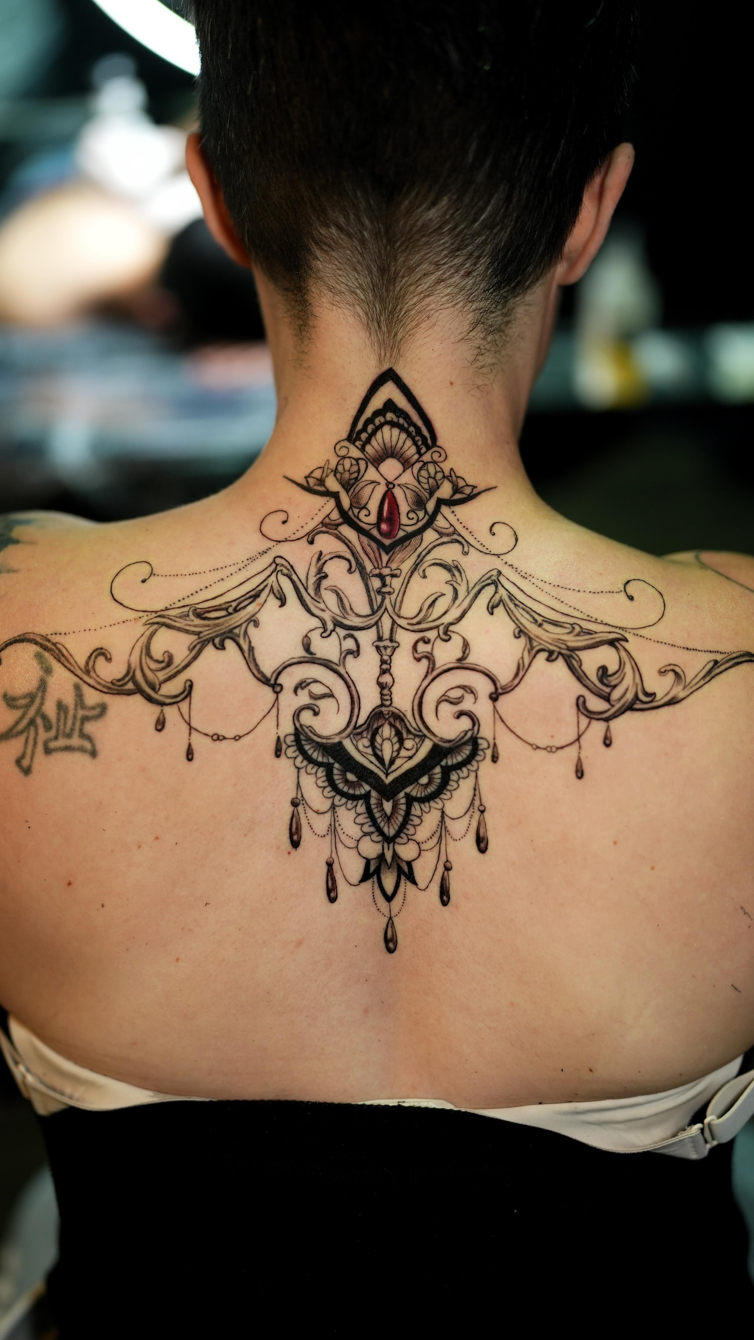 Intricate Upper Back Tattoo
