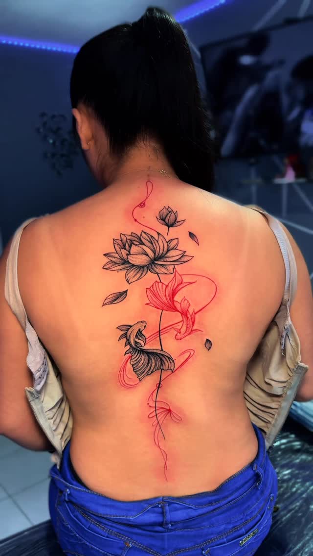 Lotus and Fish Back Tattoo
