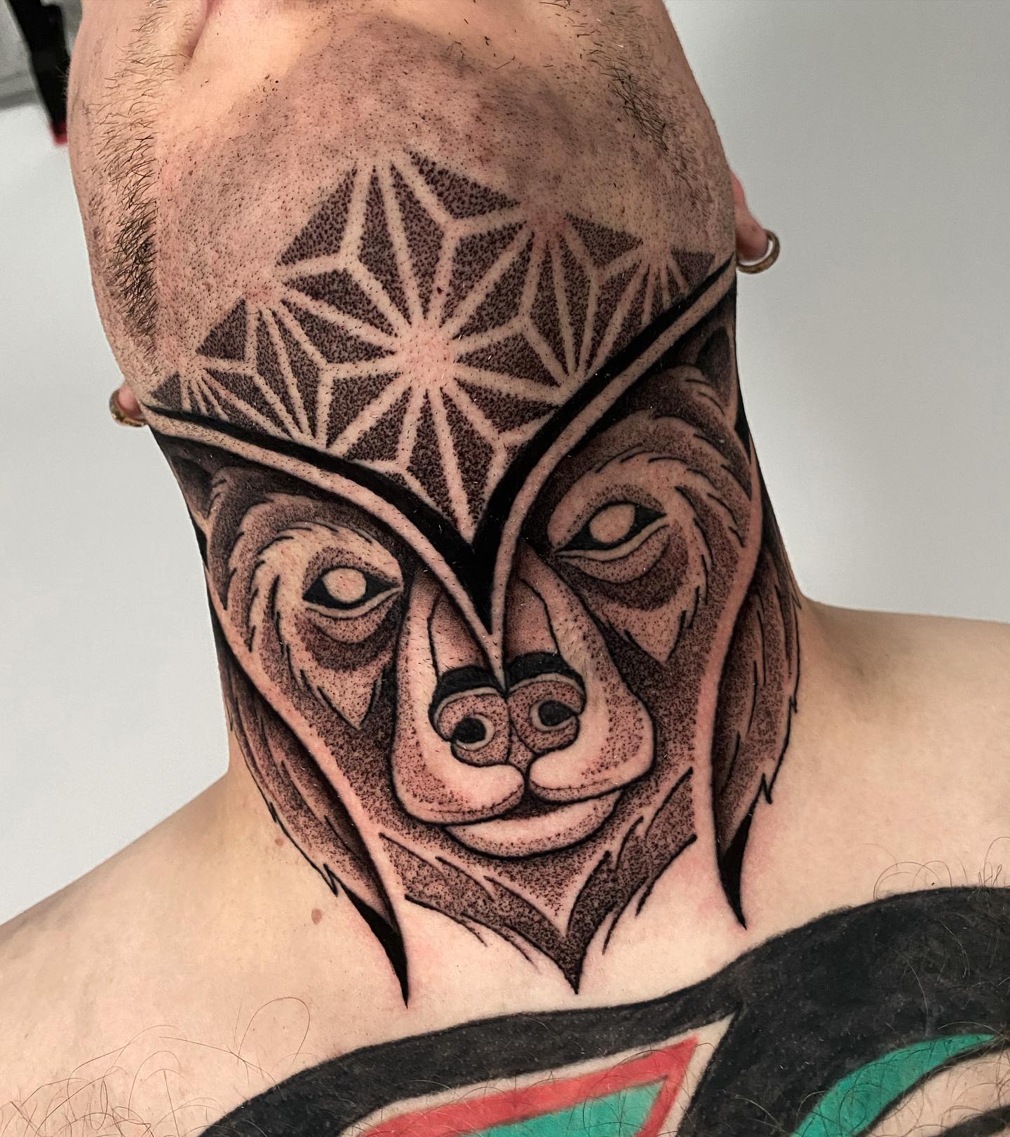 Lion Mask Throat Tattoo