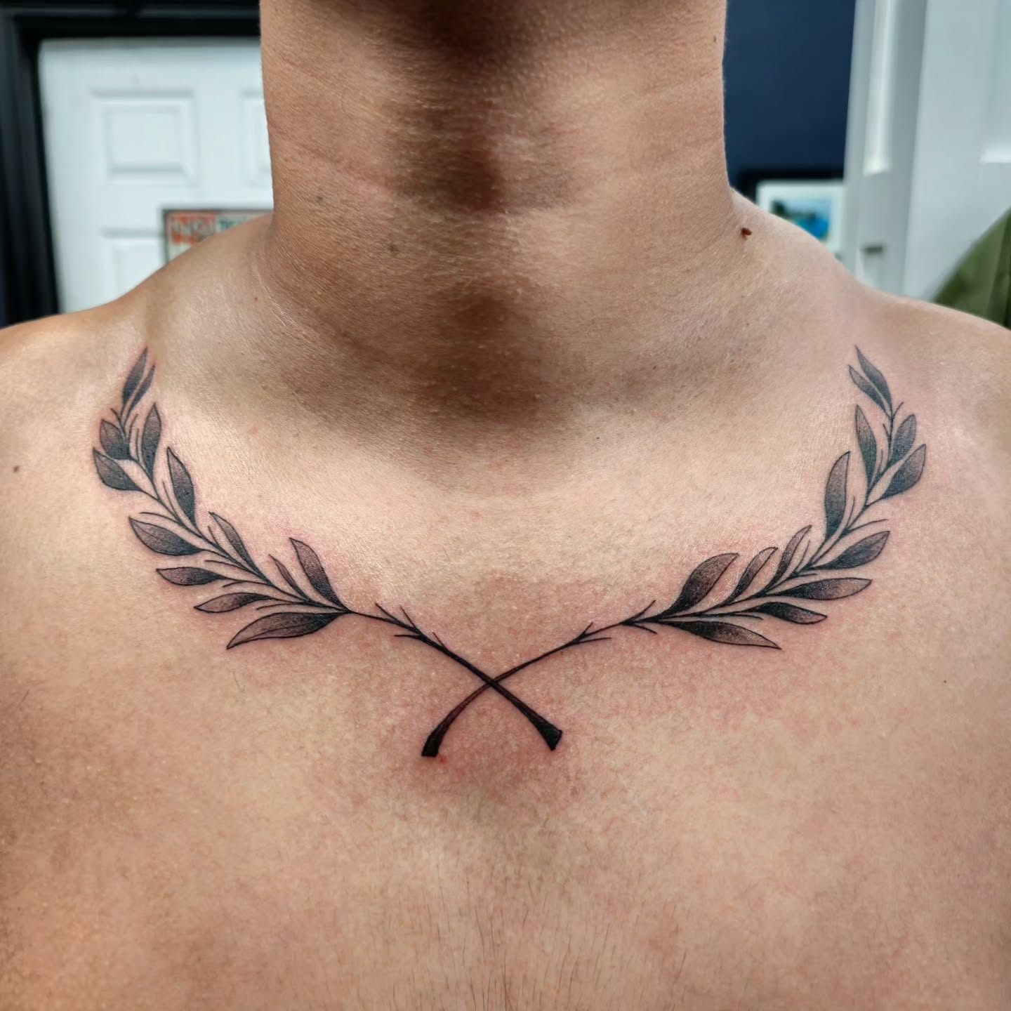 Minimalist Laurel Chest Tattoo