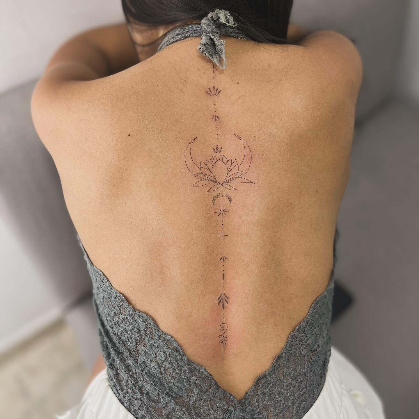 Minimalist Spine Tattoo