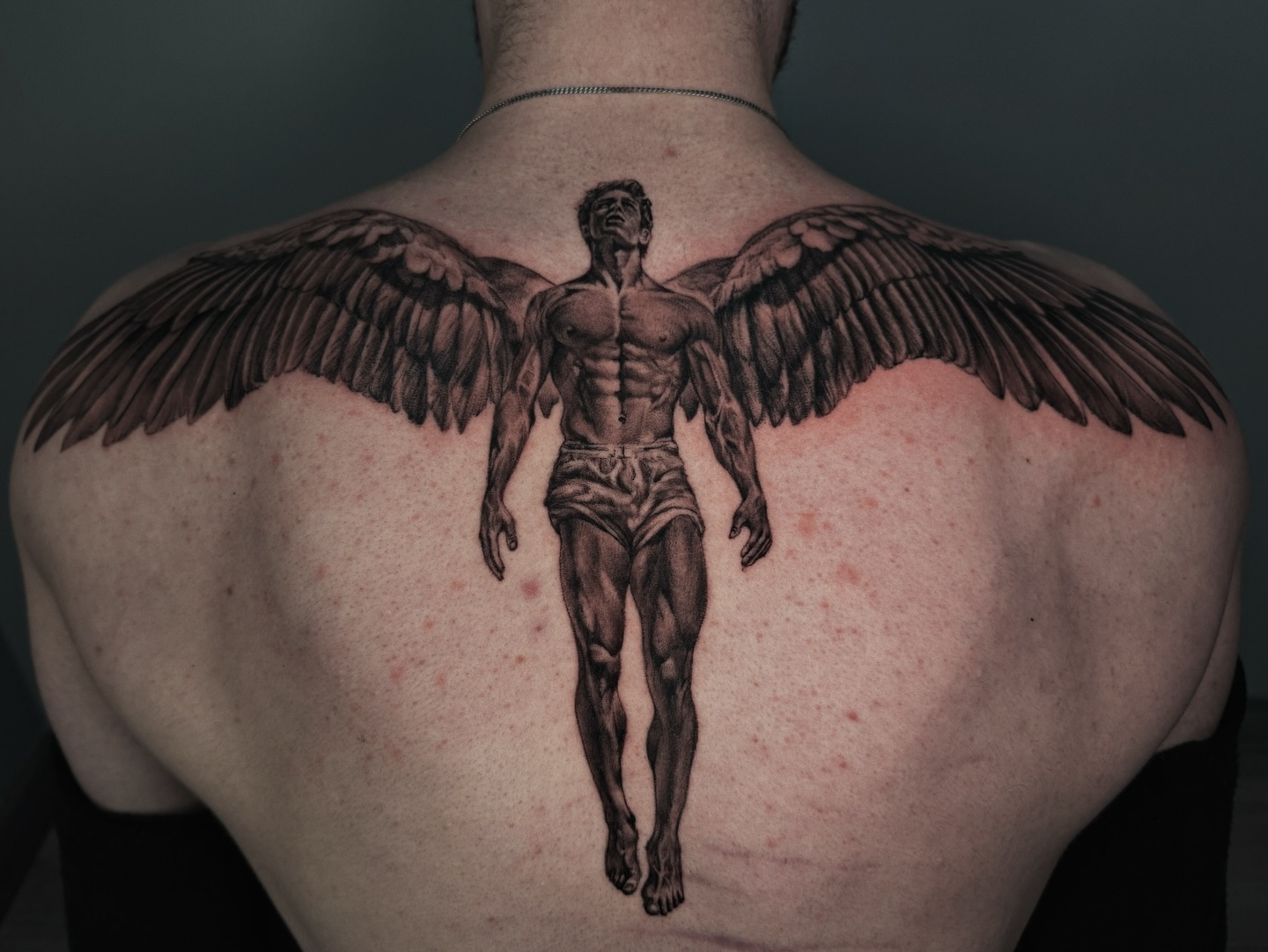Muscular Angel Wings Tattoo