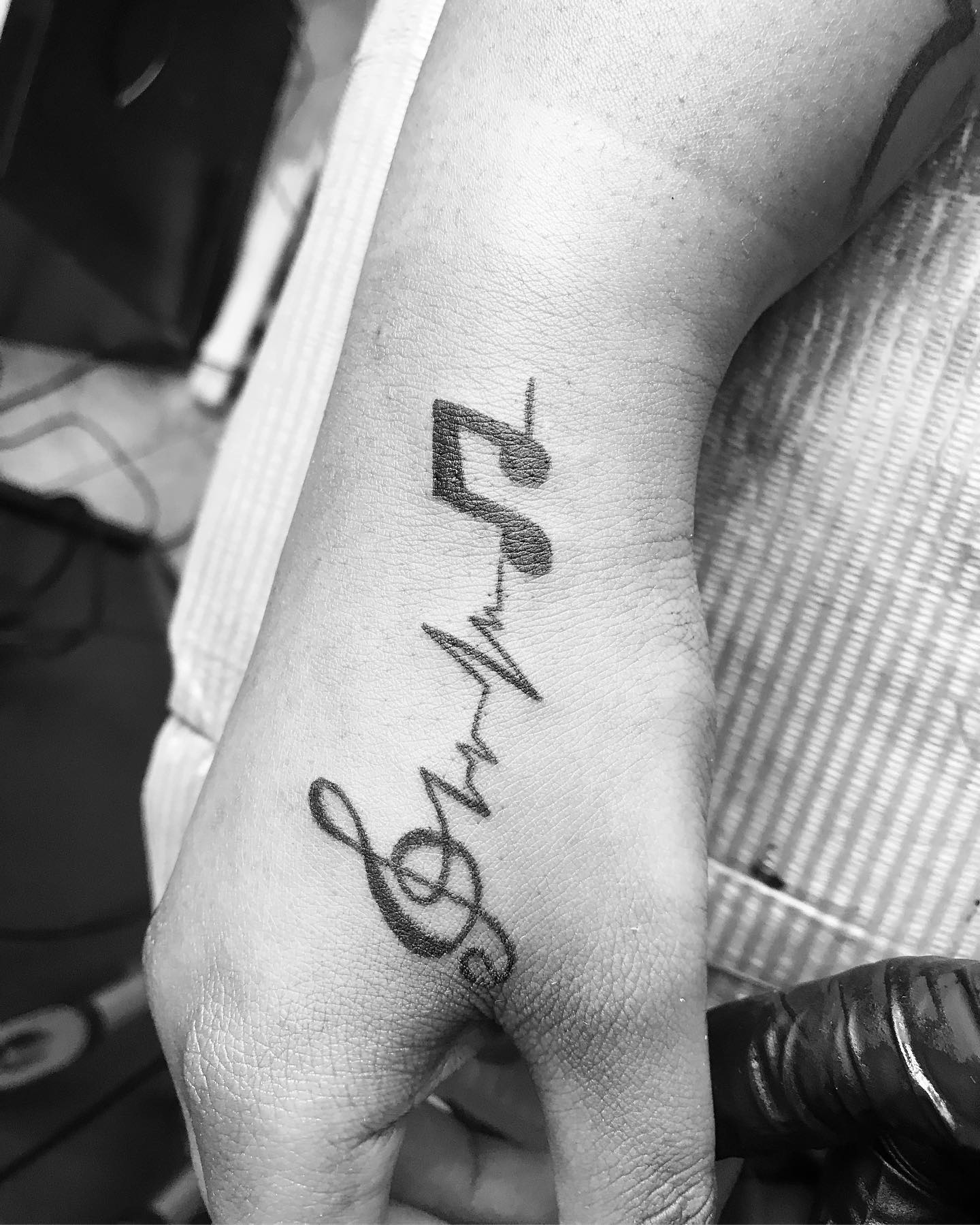 Music Notes Hand Tattoo