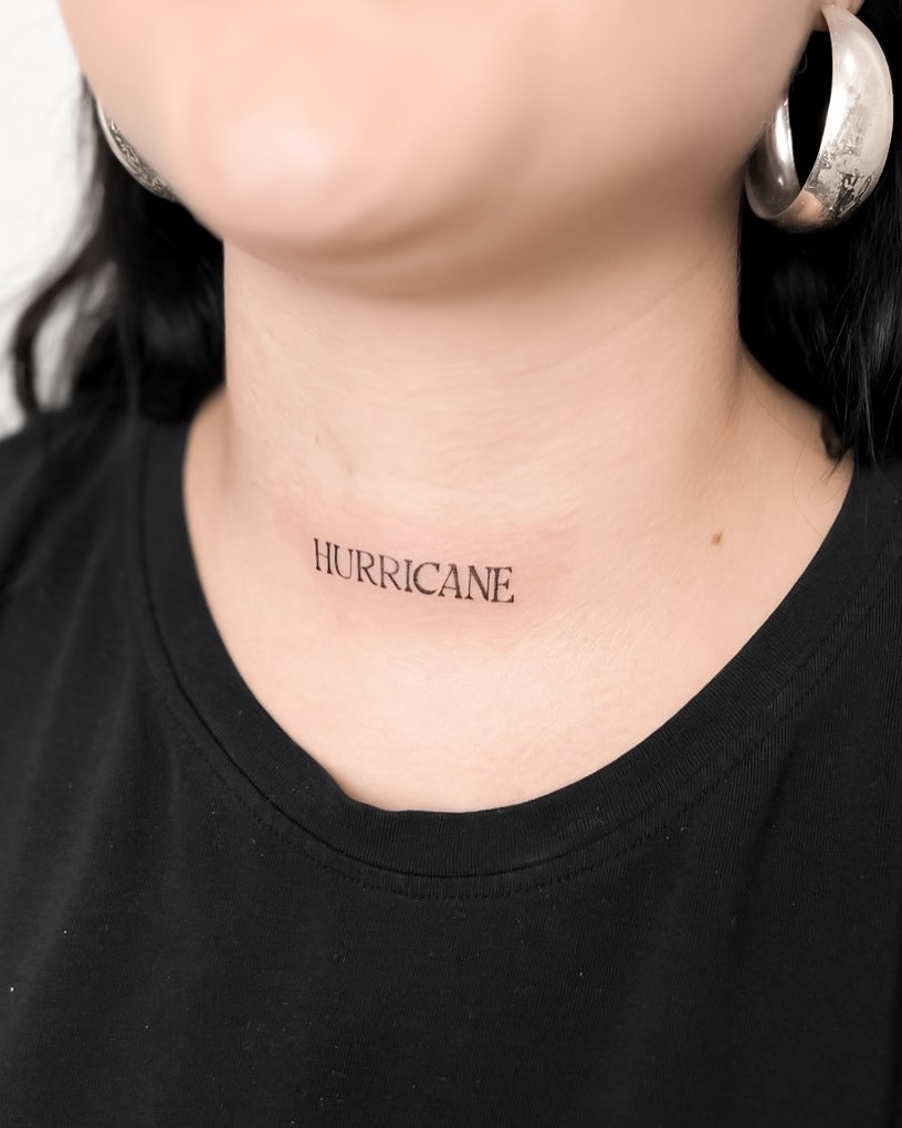 Lettering neck tattoo