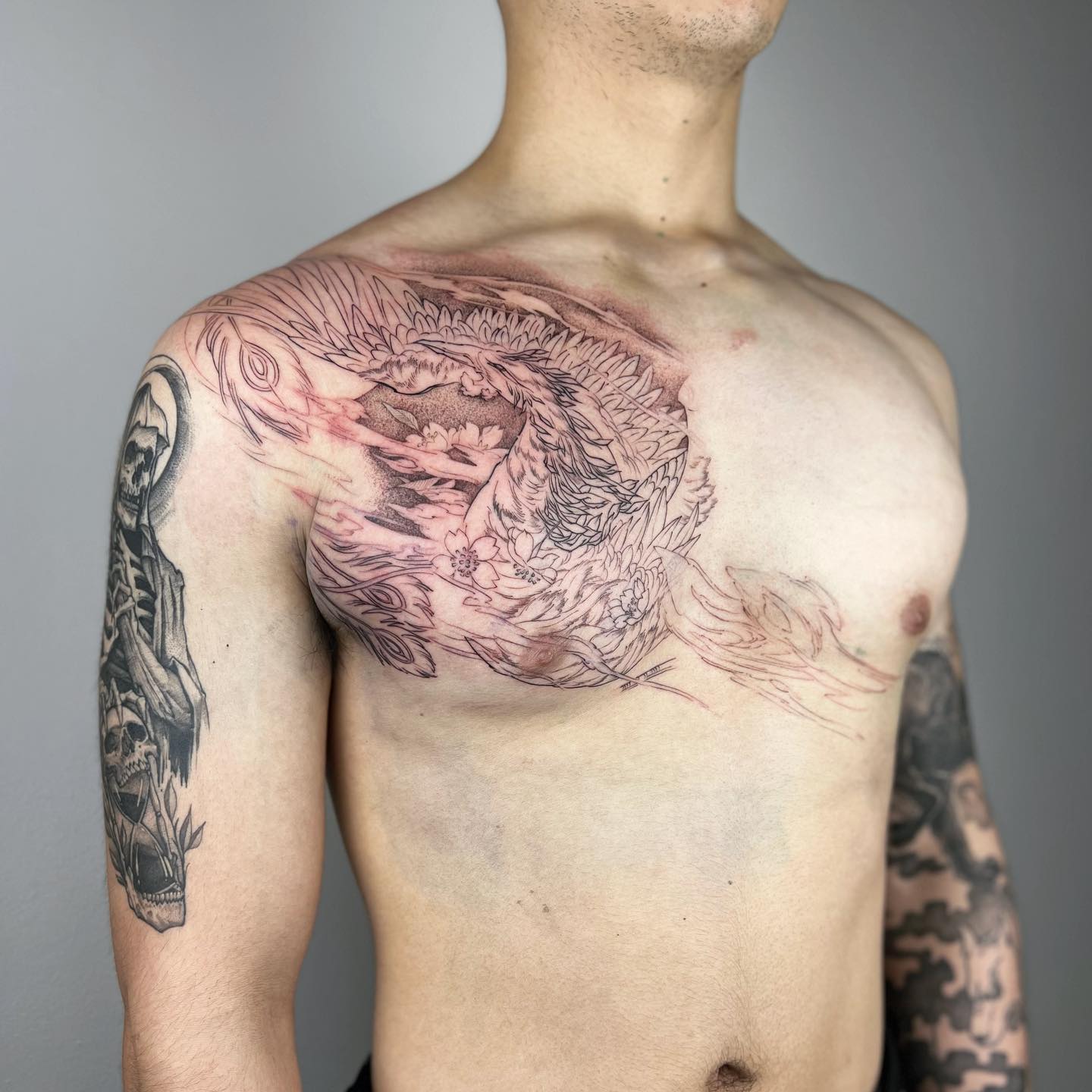 Phoenix Line Art Chest Tattoo