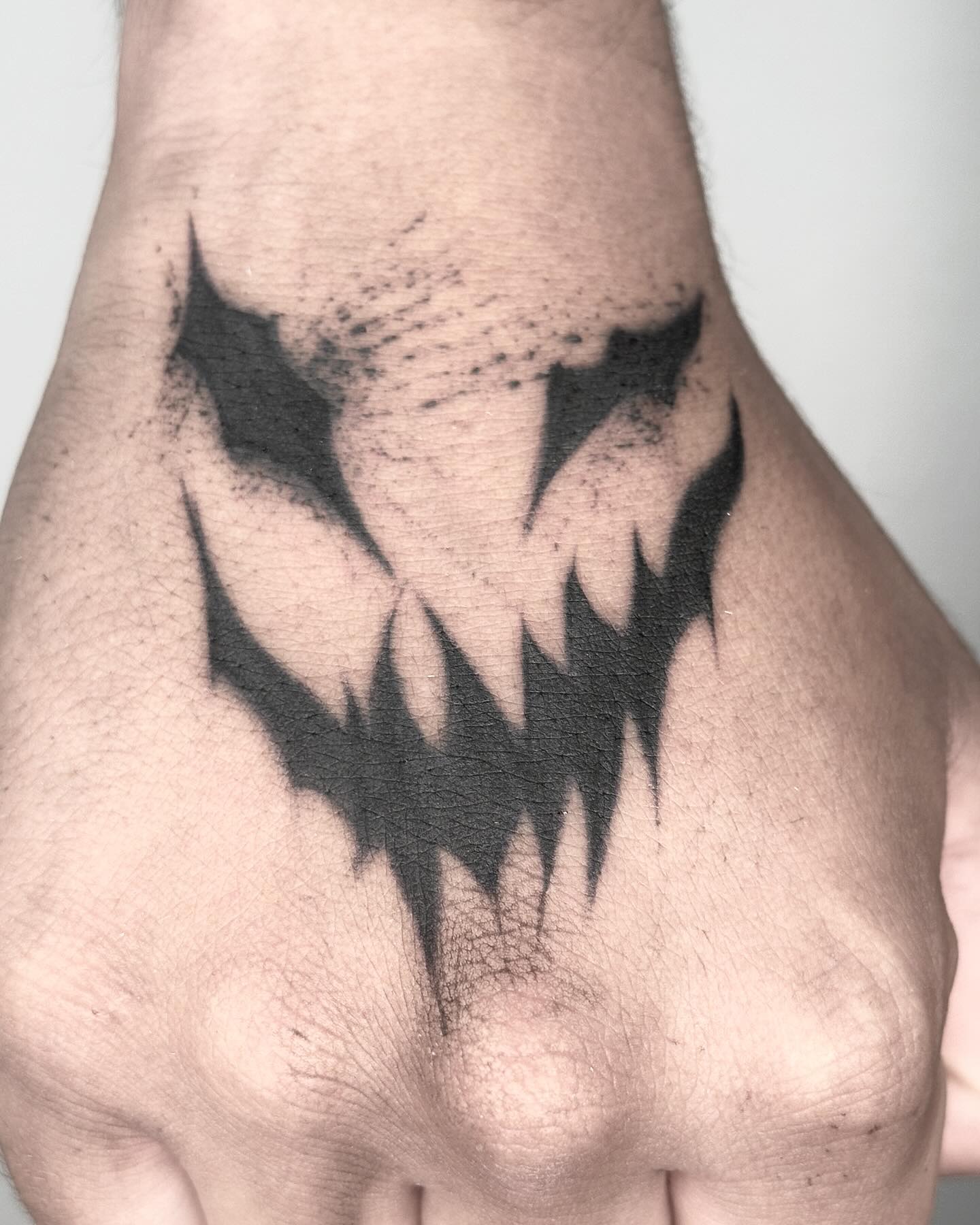 Sharp Abstract Hand Tattoo