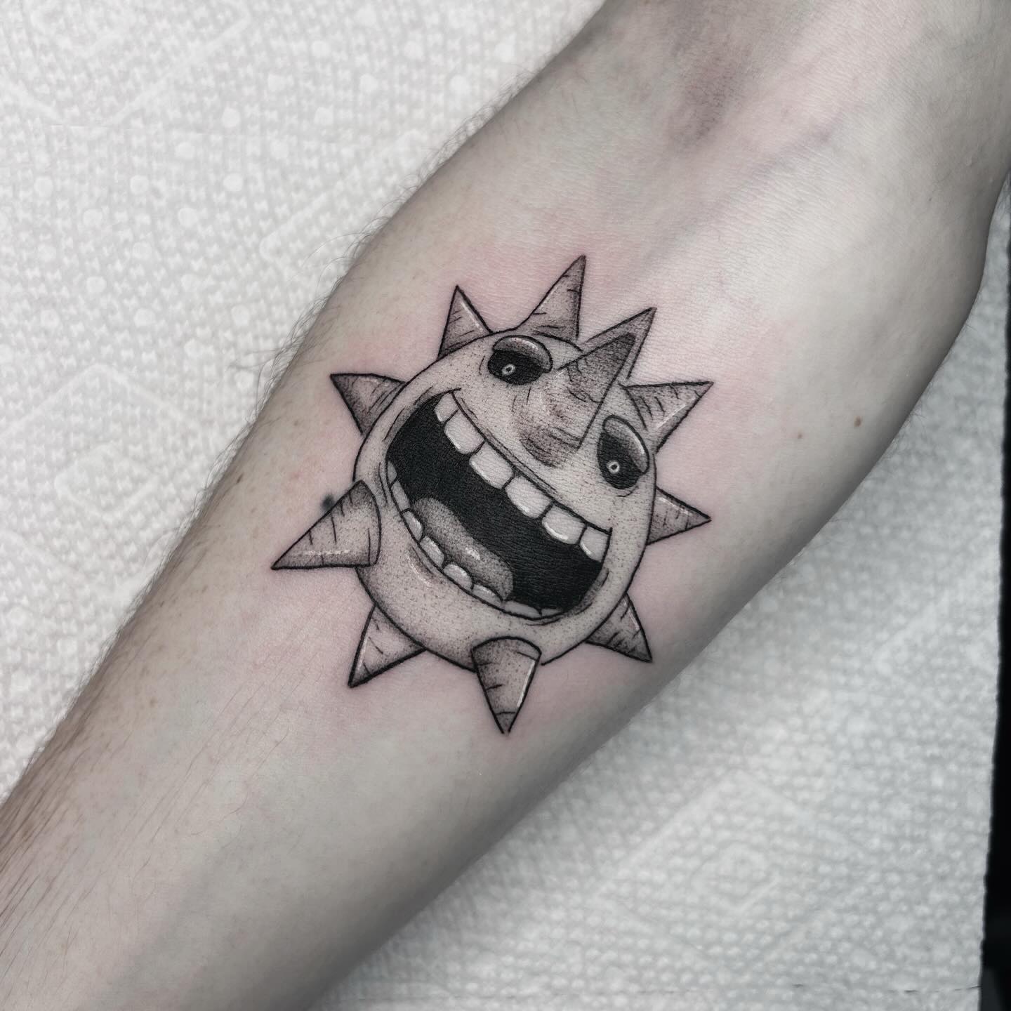 Spiky Grinning Soul Tattoo
