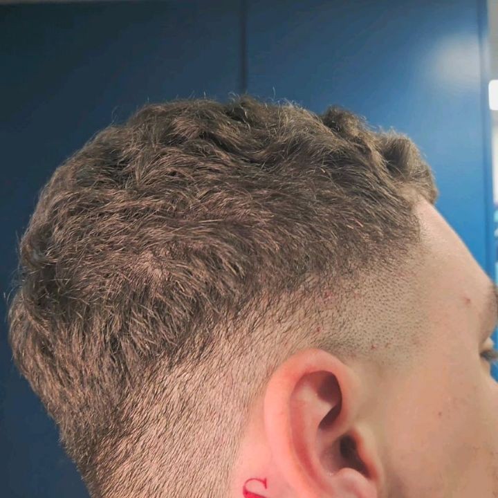 Subtle Behind-Ear Tattoo
