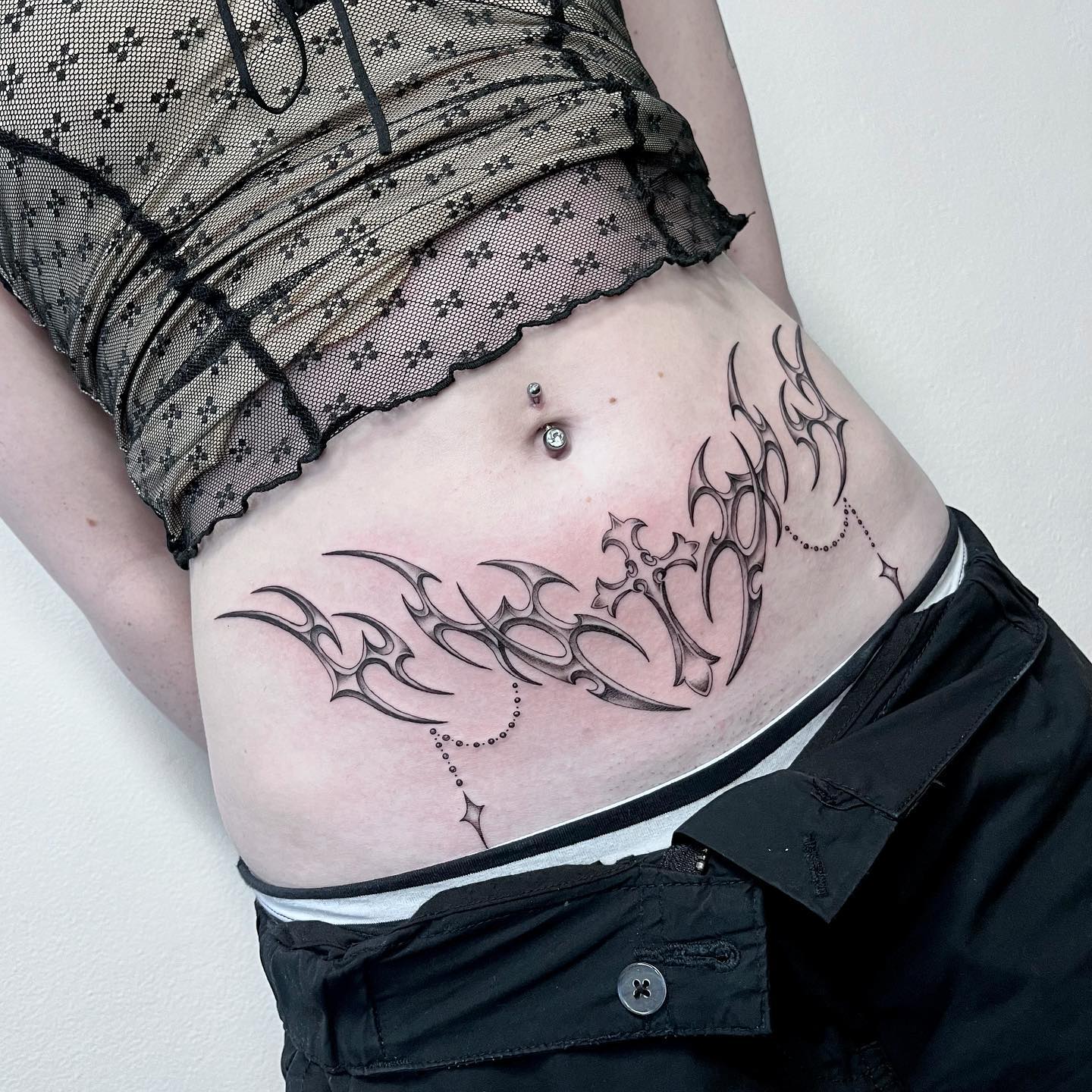 Tribal Cross Stomach Tattoo