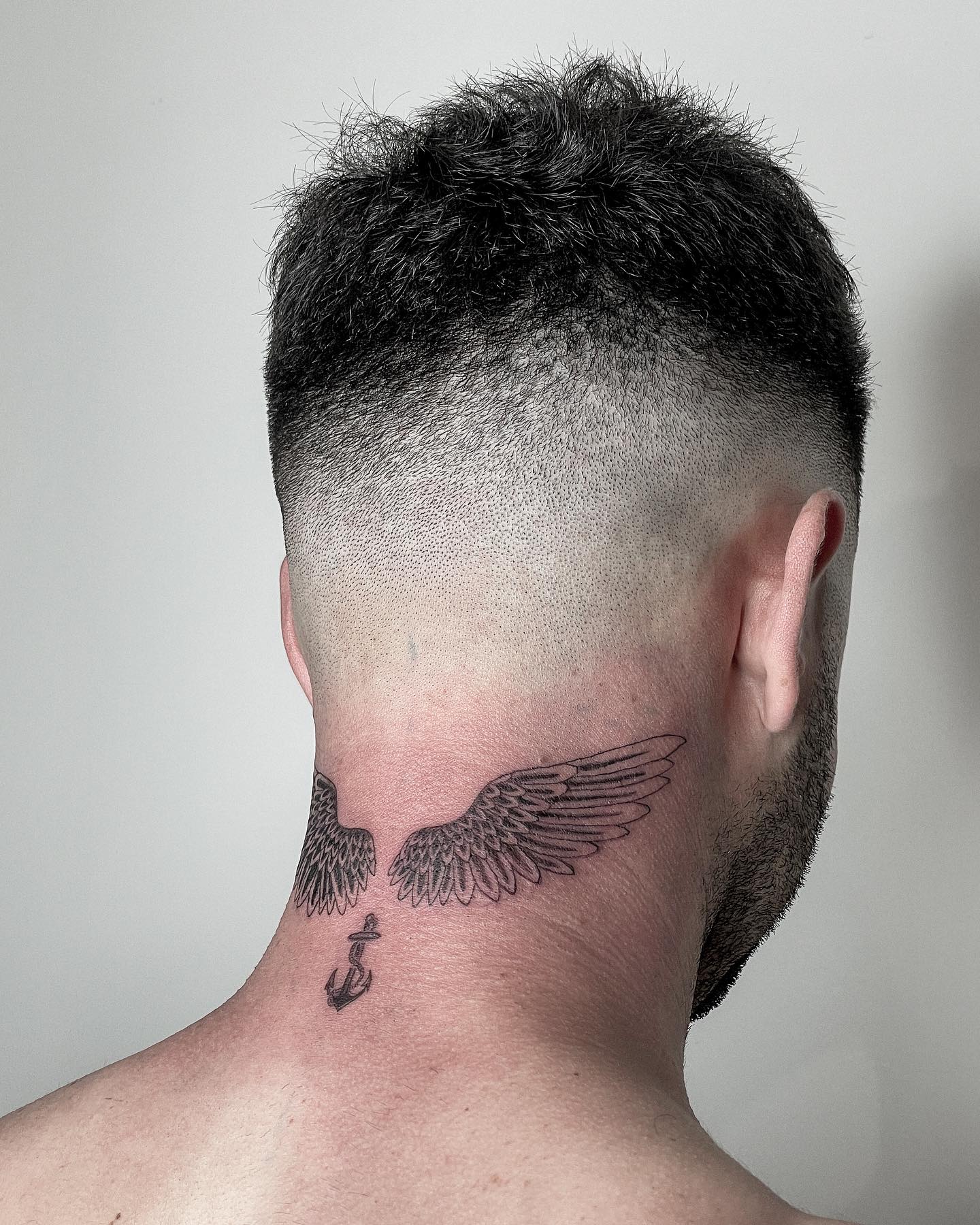 Winged Neck Tattoo